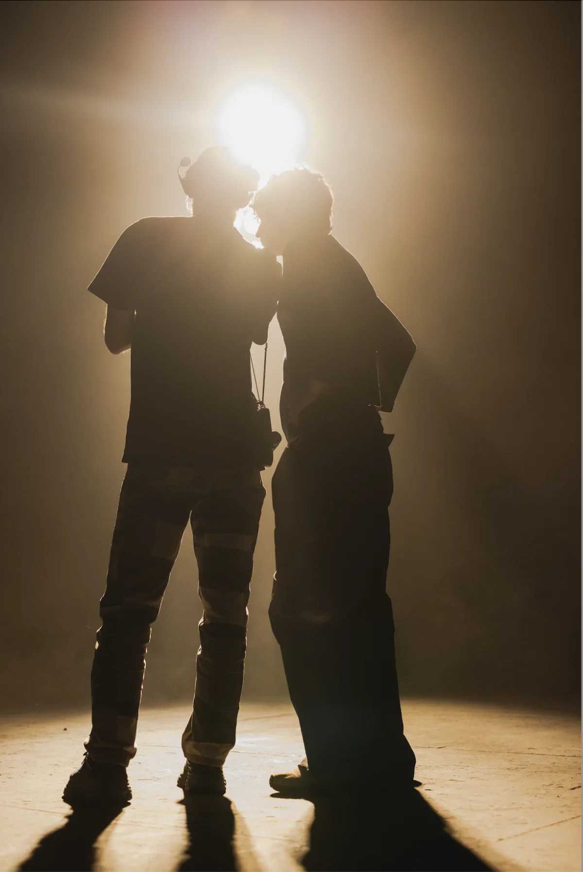 Silhouetted figures from Never Enough